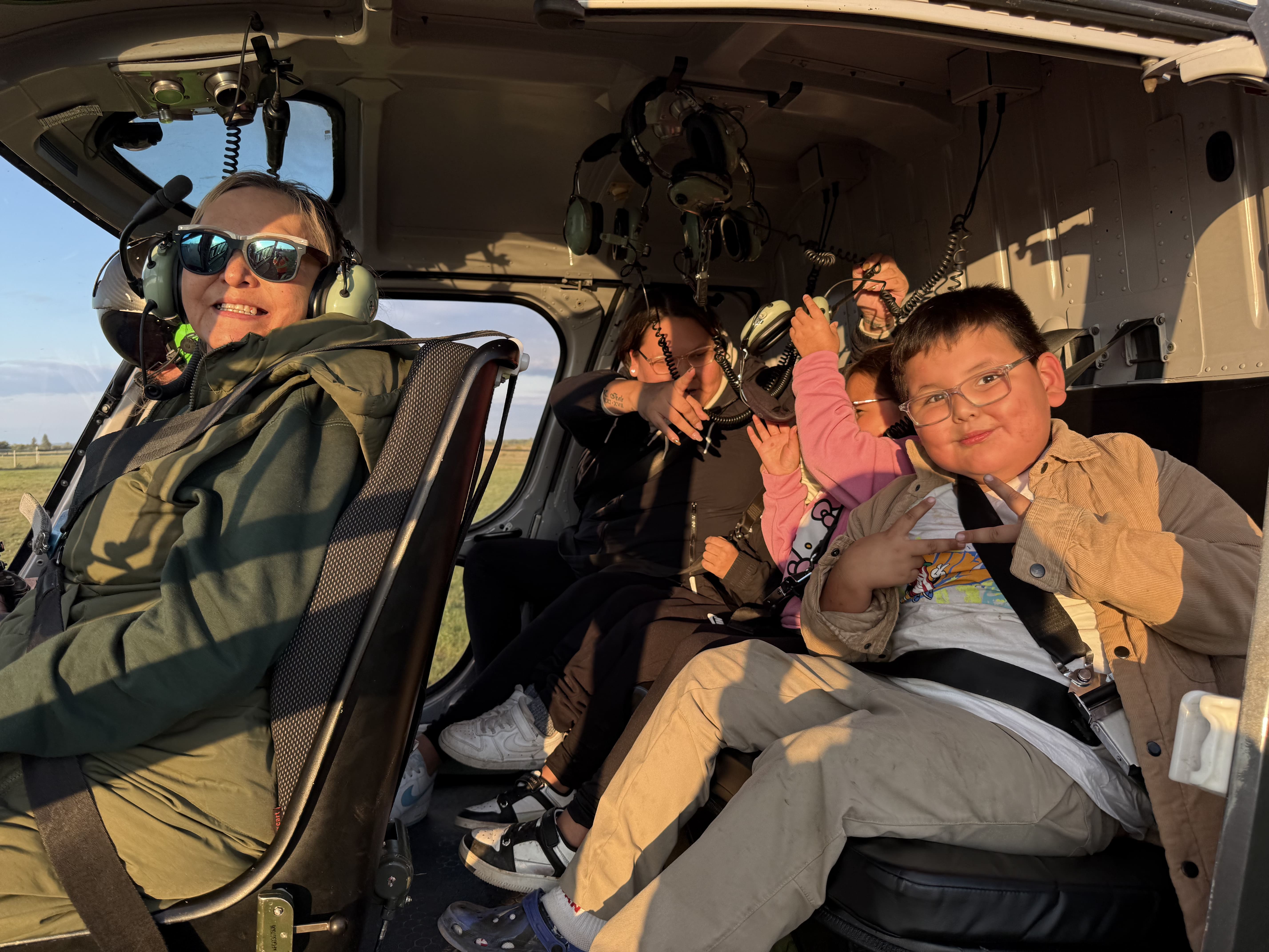 another family loading into the helicopter getting ready to fly