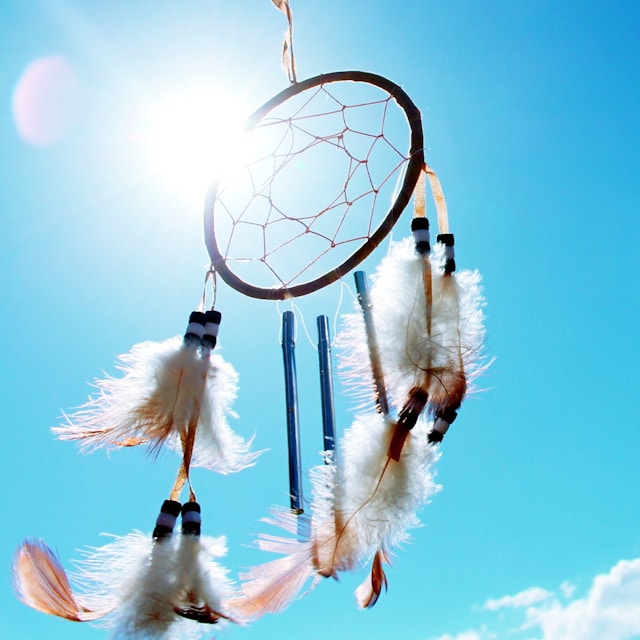 dreamcatcher against a blue sky